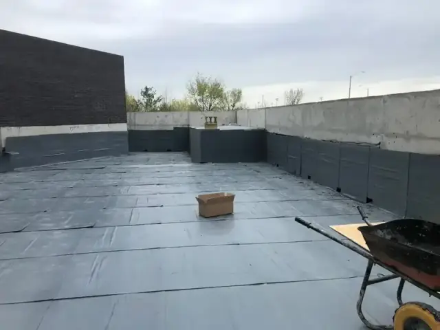 Podium deck waterproofing, membrane turned up the walls and protection board laid over it